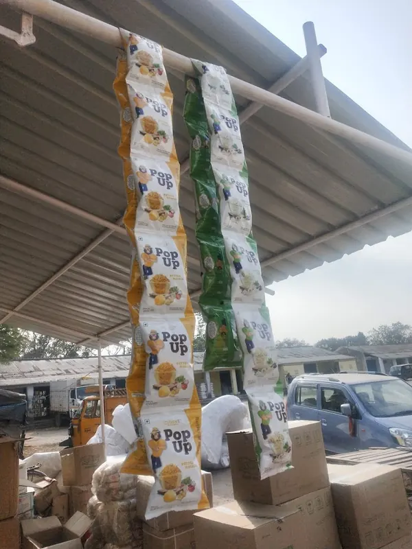 Strips of Popups flavoured popcorn packets hanging at a distribution yard in Ranchi